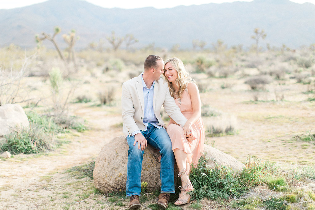 Joshua Tree Engagement Session | What to Wear for Pictures | Southern California Wedding Photographer | Mastin Labs Fuji Film | Fine Art Photographer | Desert Shoot | Sitting on Rock.jpg