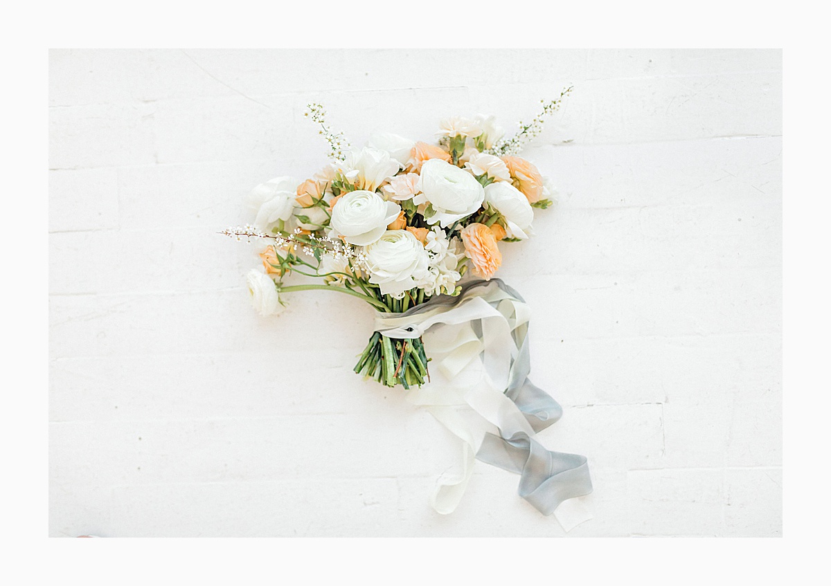 The Bemis Building in downtown Seattle is one of my favorite places to use for photo shoots!  This styled bridal shoot with touches of peach and white was dreamy.  #emmarosecompany #kindredpresets #seattlebride_0006.jpg