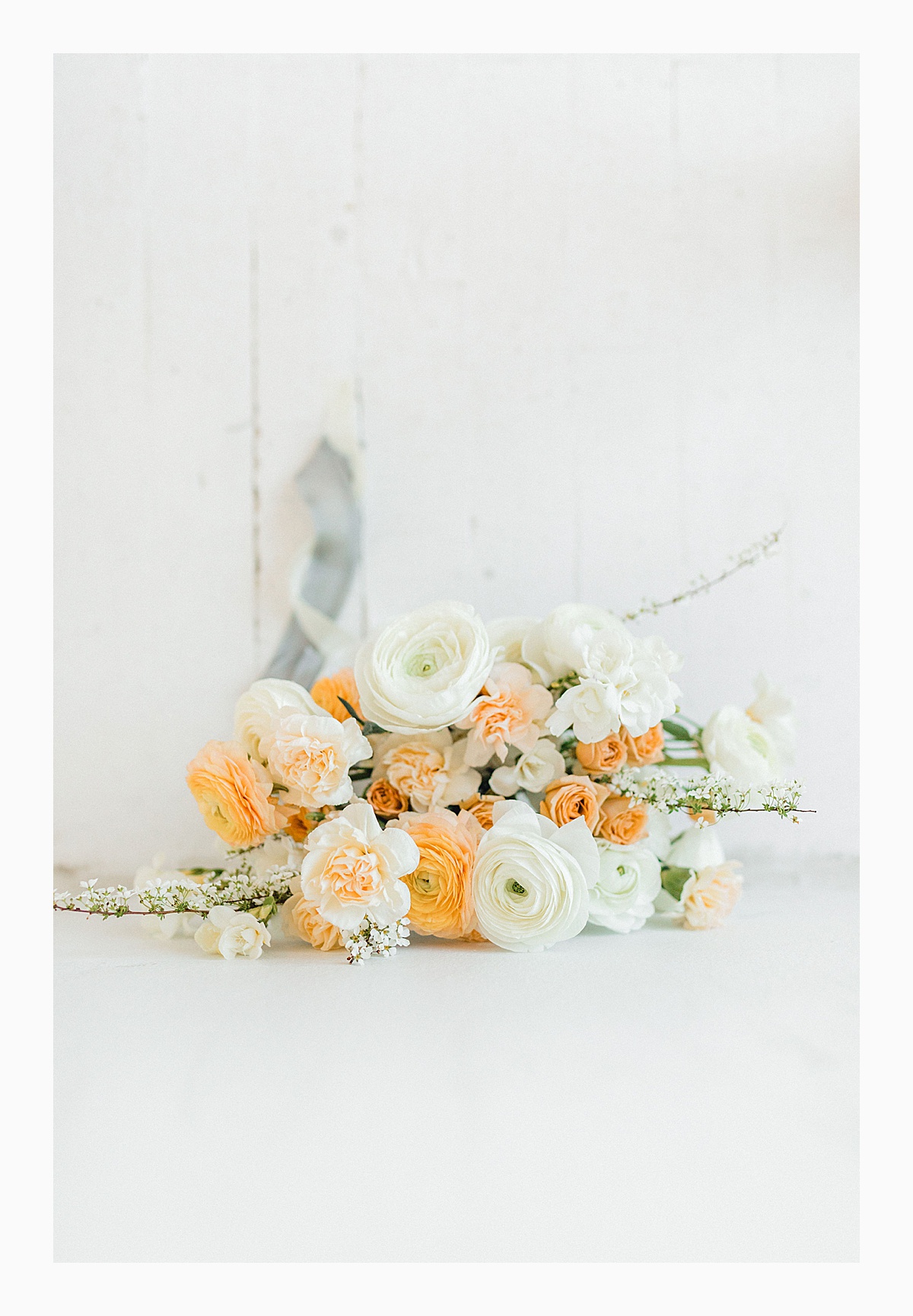 The Bemis Building in downtown Seattle is one of my favorite places to use for photo shoots!  This styled bridal shoot with touches of peach and white was dreamy.  #emmarosecompany #kindredpresets #seattlebride_0008.jpg