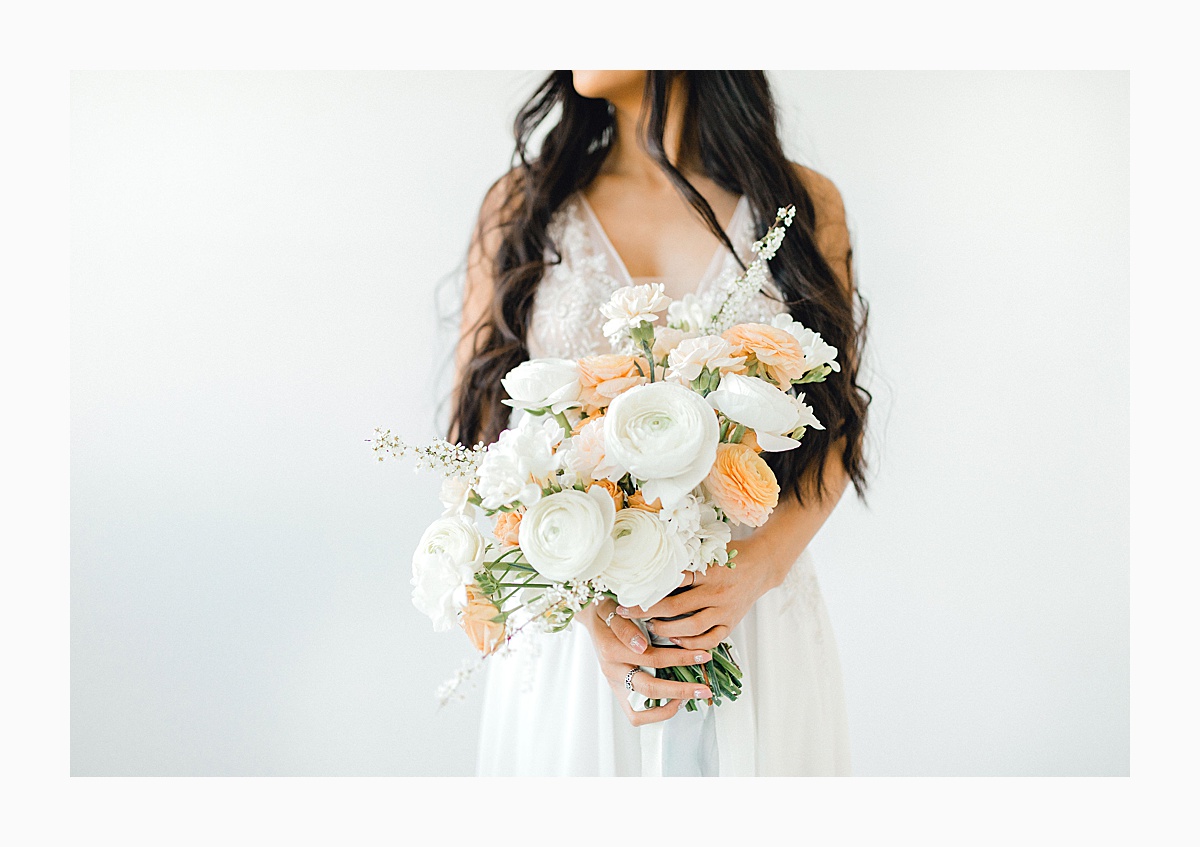The Bemis Building in downtown Seattle is one of my favorite places to use for photo shoots!  This styled bridal shoot with touches of peach and white was dreamy.  #emmarosecompany #kindredpresets #seattlebride_0014.jpg