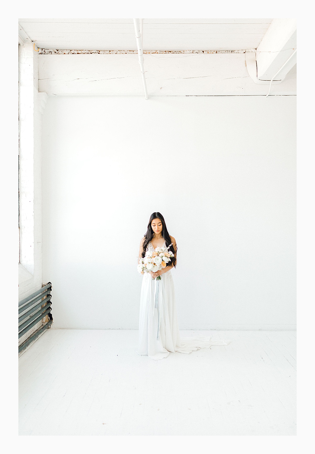The Bemis Building in downtown Seattle is one of my favorite places to use for photo shoots!  This styled bridal shoot with touches of peach and white was dreamy.  #emmarosecompany #kindredpresets #seattlebride_0015.jpg