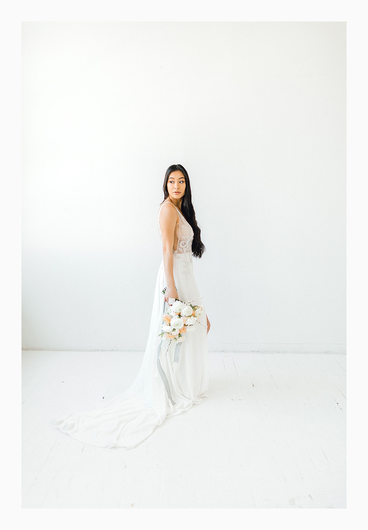 The Bemis Building in downtown Seattle is one of my favorite places to use for photo shoots!  This styled bridal shoot with touches of peach and white was dreamy.  #emmarosecompany #kindredpresets #seattlebride_0017.jpg