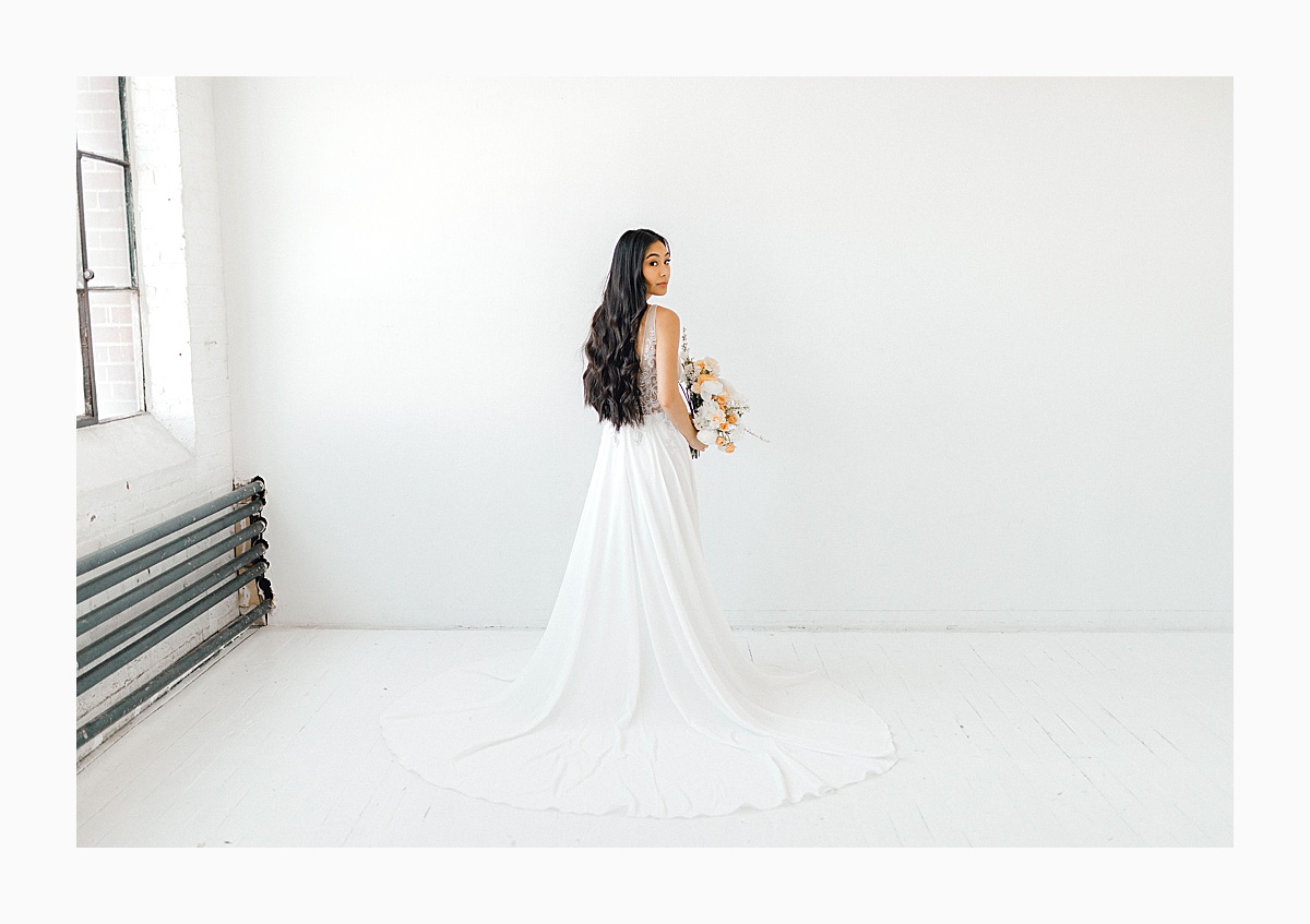 The Bemis Building in downtown Seattle is one of my favorite places to use for photo shoots!  This styled bridal shoot with touches of peach and white was dreamy.  #emmarosecompany #kindredpresets #seattlebride_0022.jpg