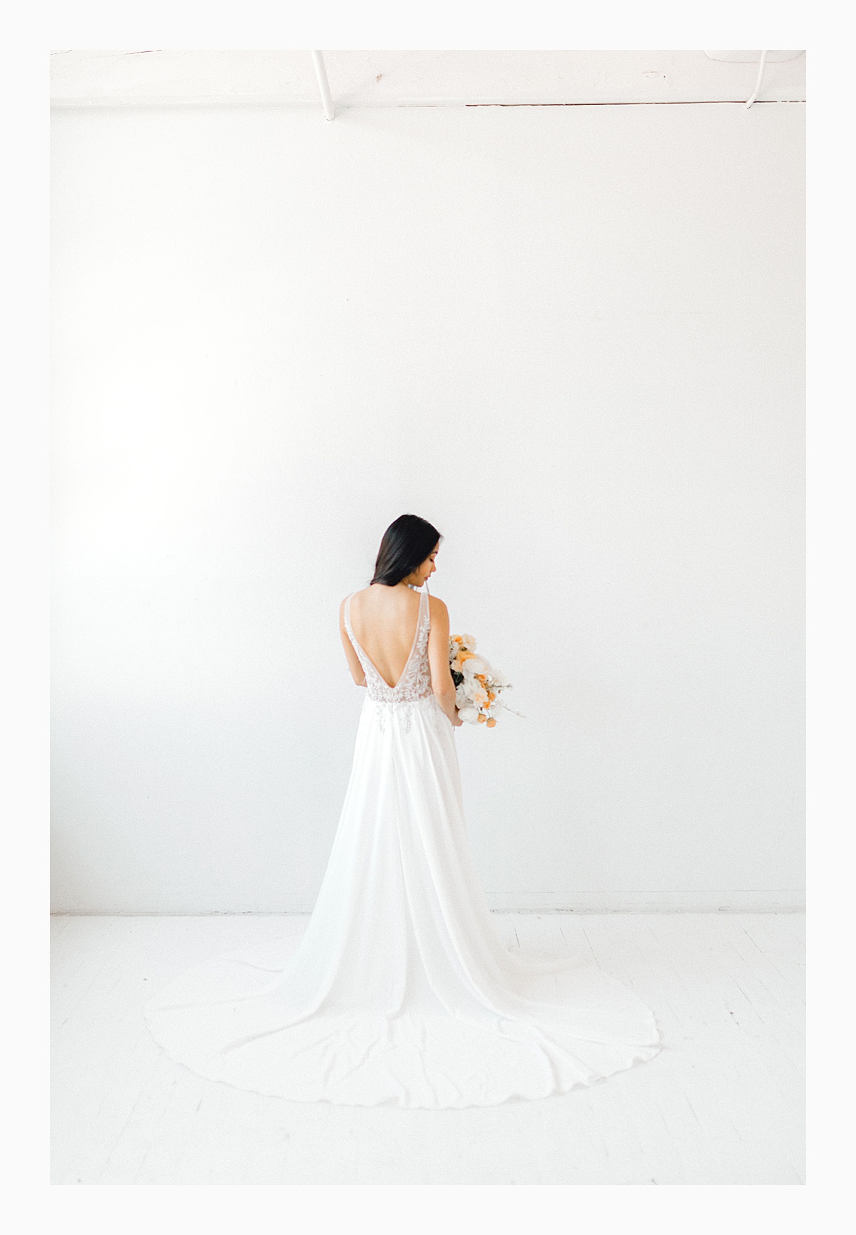 The Bemis Building in downtown Seattle is one of my favorite places to use for photo shoots!  This styled bridal shoot with touches of peach and white was dreamy.  #emmarosecompany #kindredpresets #seattlebride_0023.jpg