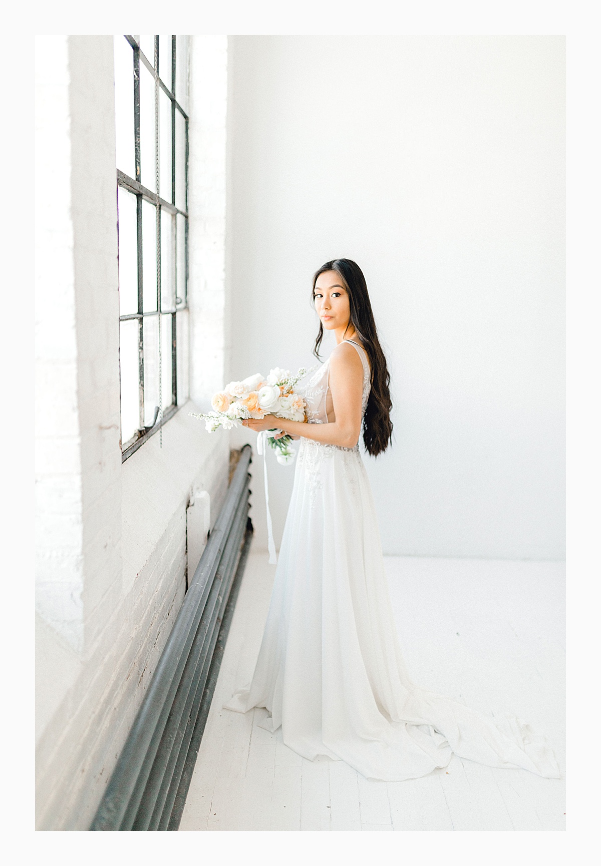 The Bemis Building in downtown Seattle is one of my favorite places to use for photo shoots!  This styled bridal shoot with touches of peach and white was dreamy.  #emmarosecompany #kindredpresets #seattlebride_0025.jpg