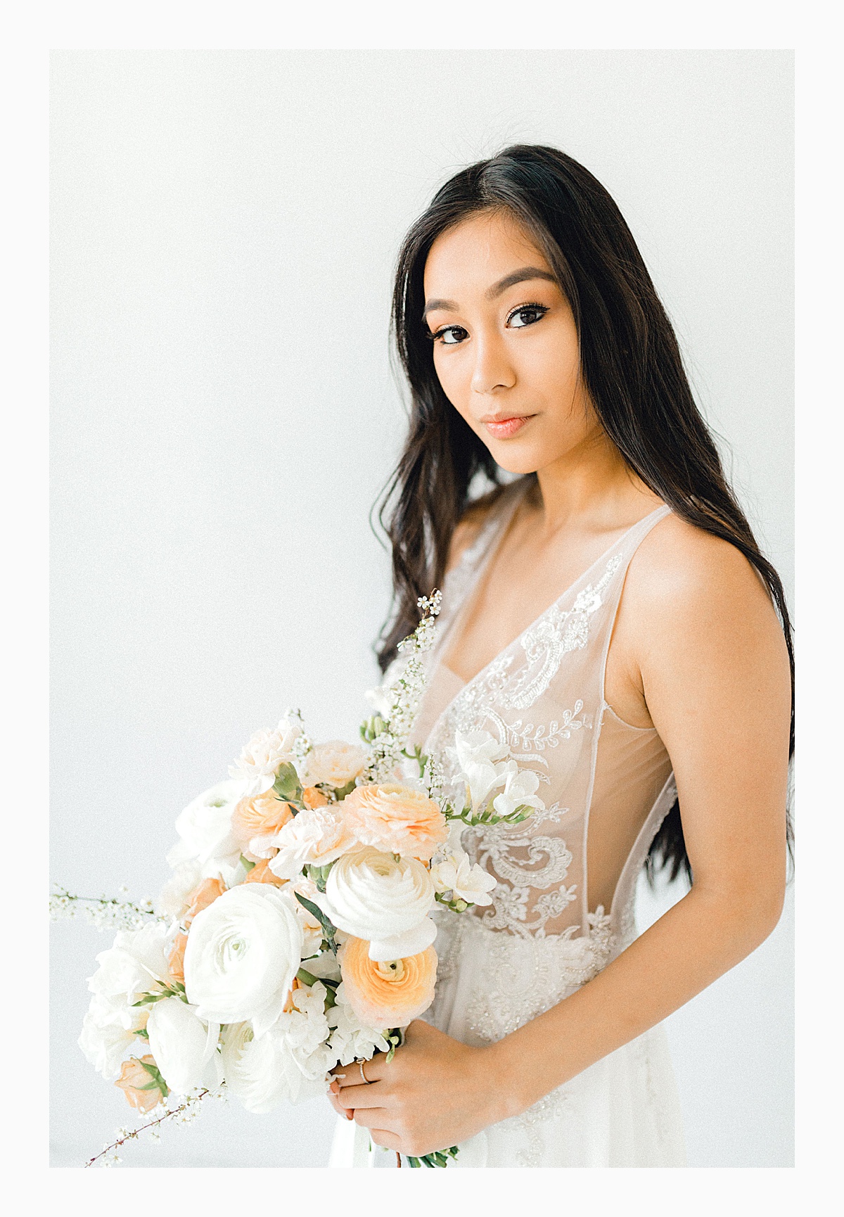 The Bemis Building in downtown Seattle is one of my favorite places to use for photo shoots!  This styled bridal shoot with touches of peach and white was dreamy.  #emmarosecompany #kindredpresets #seattlebride_0028.jpg