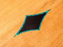 Opal inlay in a guitar