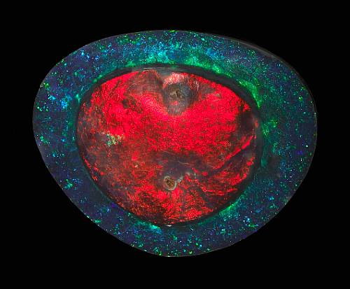 The Flame Queen, 263 carat black opal. Exhibits the 'Eye of Opal' - when mineral gel fills a cavity to form a precious stone 