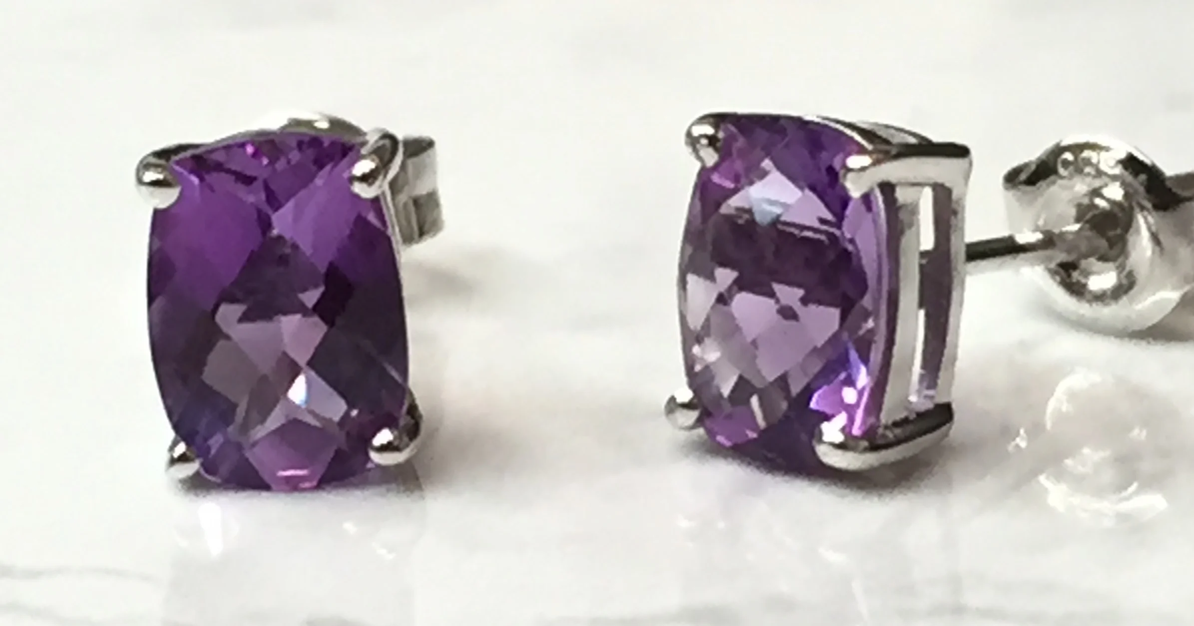 A pair of our amethyst earrings: 14K white gold, post back, on sale for $149.00