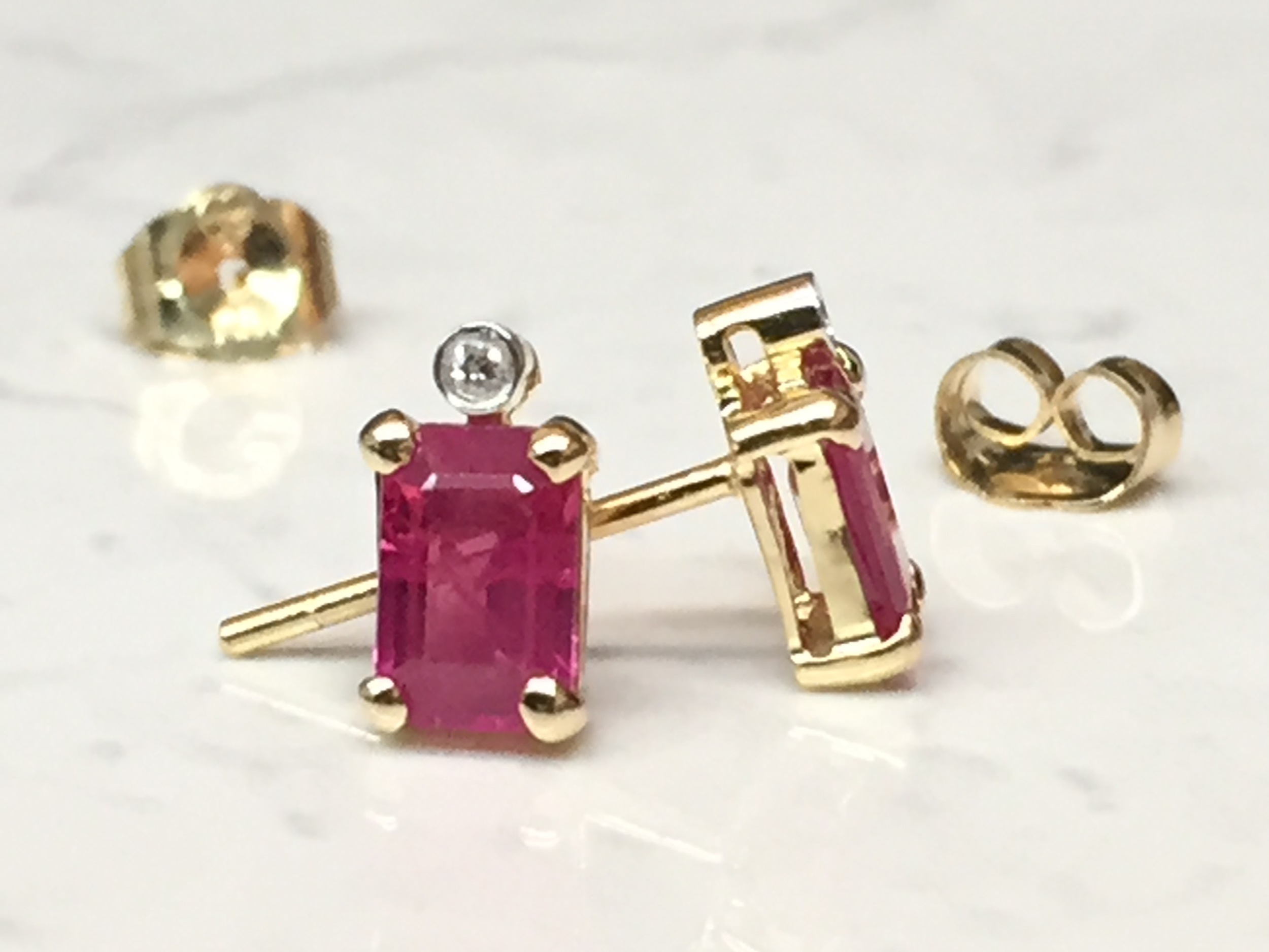 Gorgeous step-cut Ruby earrings with diamond accents
