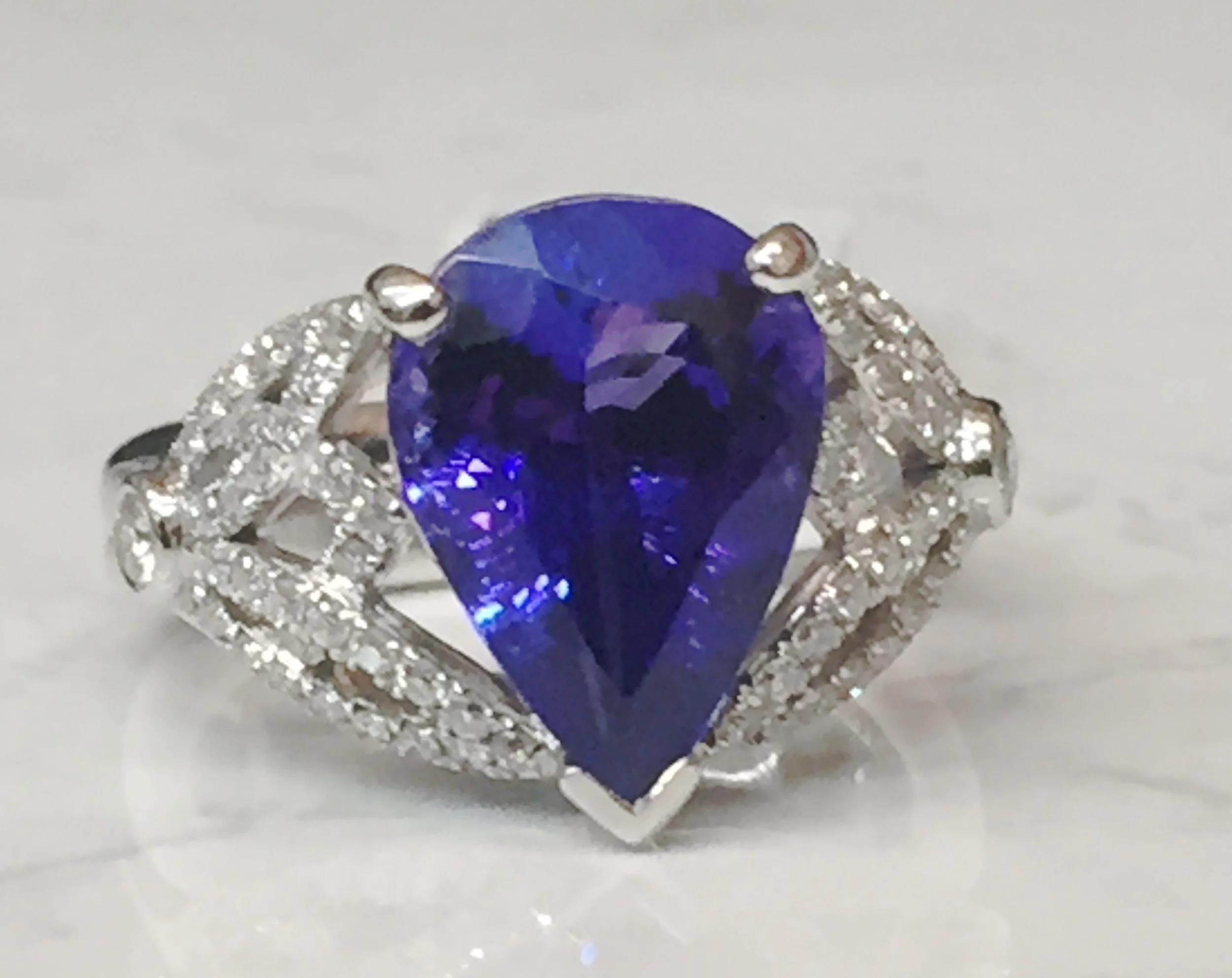 Stunning 5.0 ct Tanzanite with 0.46 ctw diamonds in a 18K white gold mount. $11,541.20
