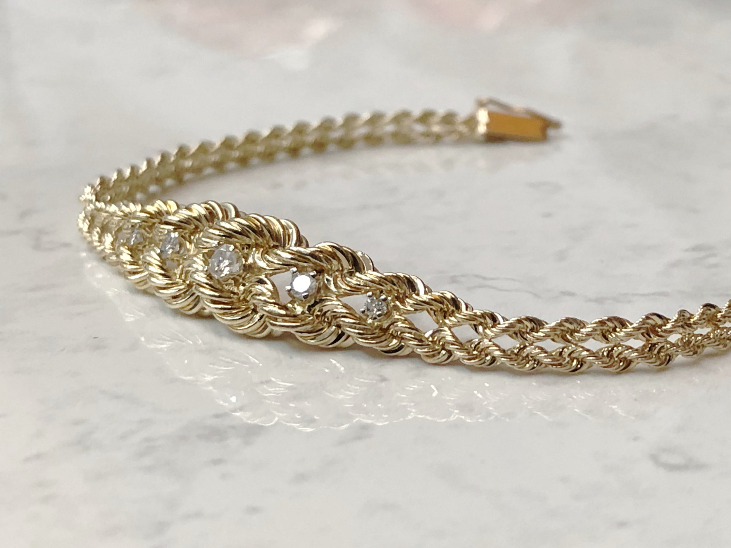 Rope bracelet with a gold and diamond closure