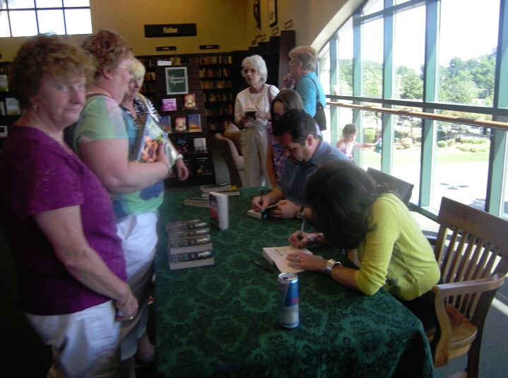  Kevin and Rebecca doing a signing. Contrary to popular opinion, their autographs do  not  decrease the value of the books (drastically). 