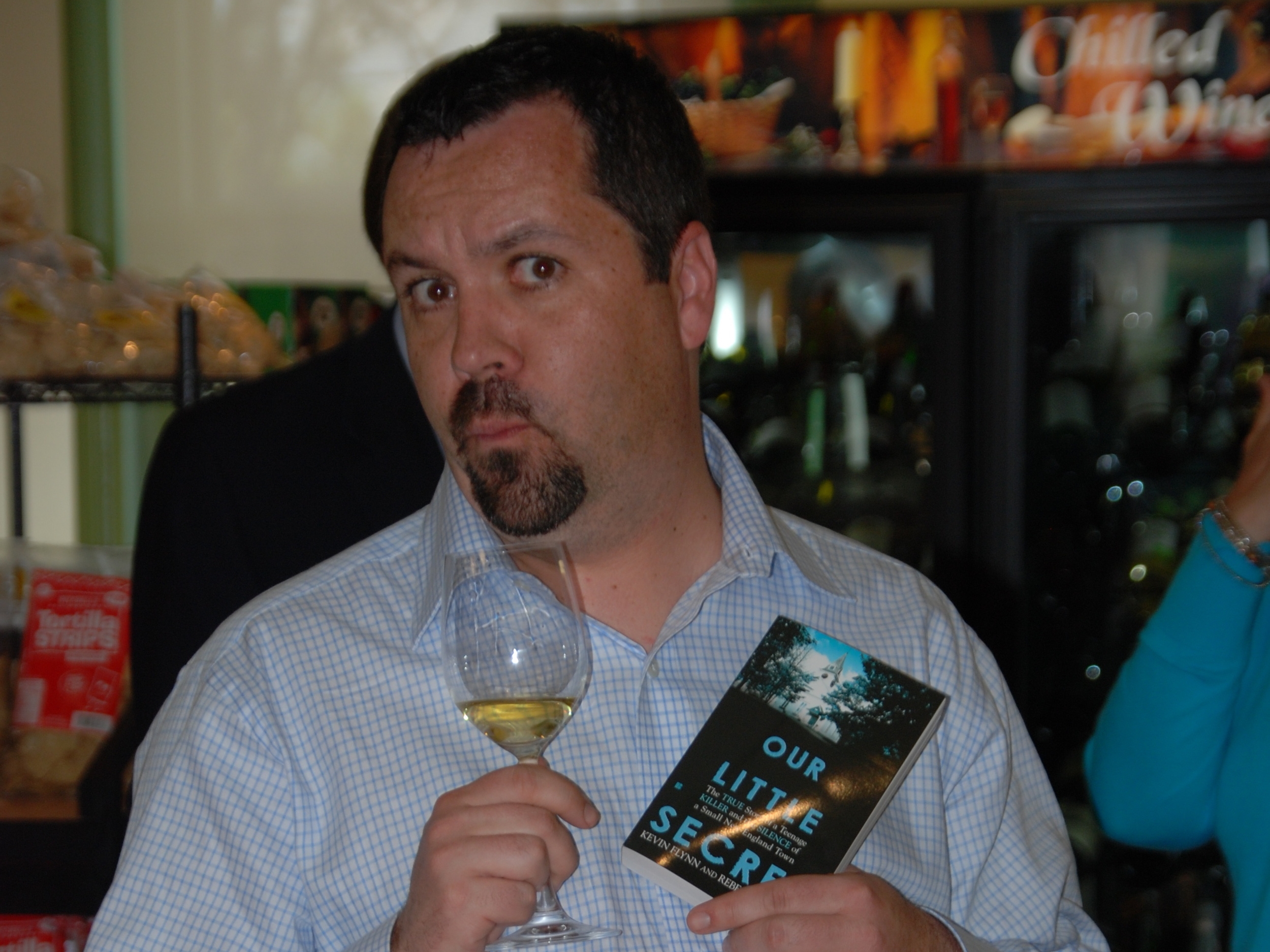 Kevin have wine and cheese at the launch party for Our Little Secret . Despite what you might think, white wine is a better pairing for true crime.