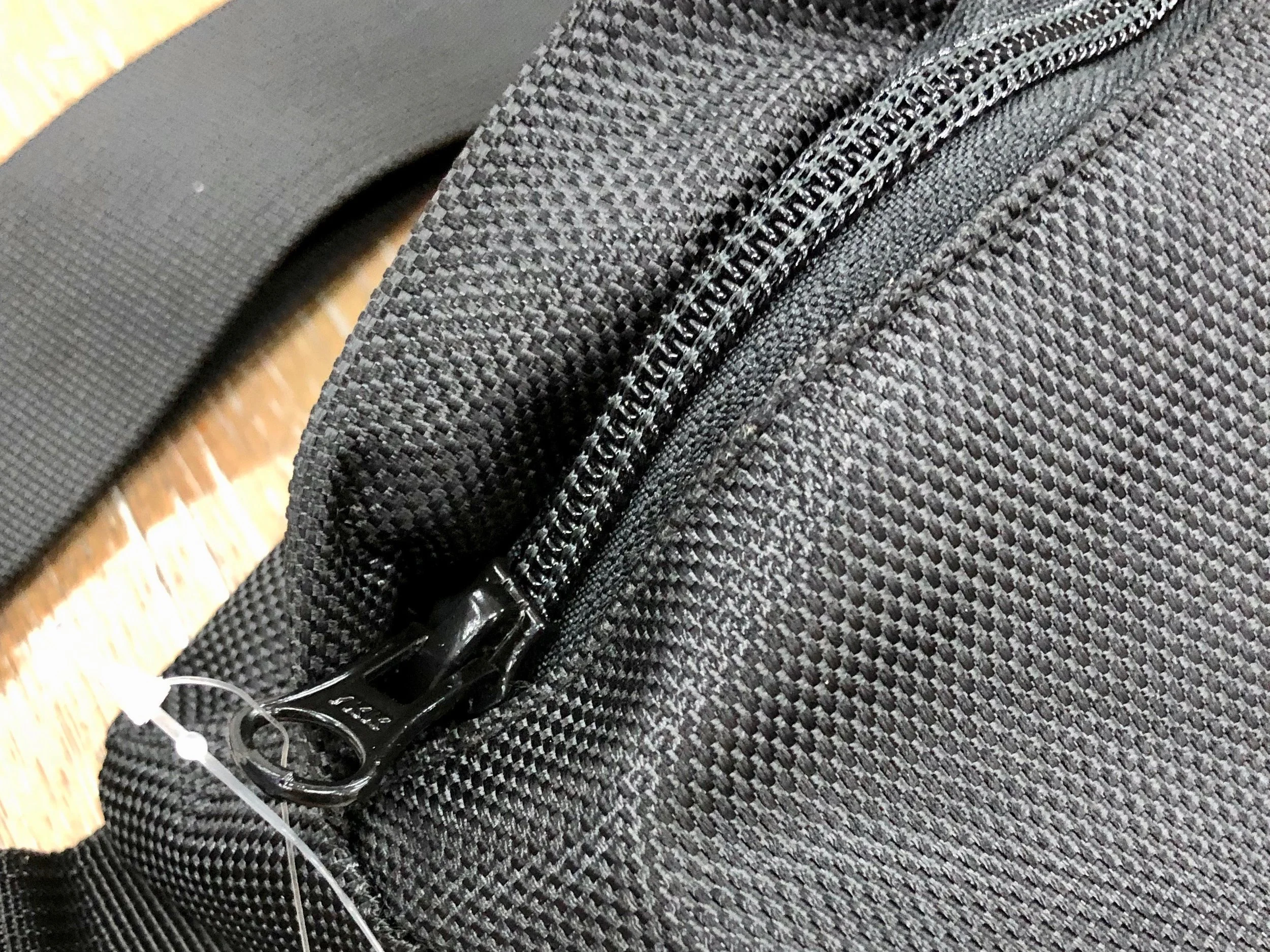 This is a very high quality zipper. It won’t catch or break even under stress. Note too the zipper is covered by a fabric flap to improve water resistance.