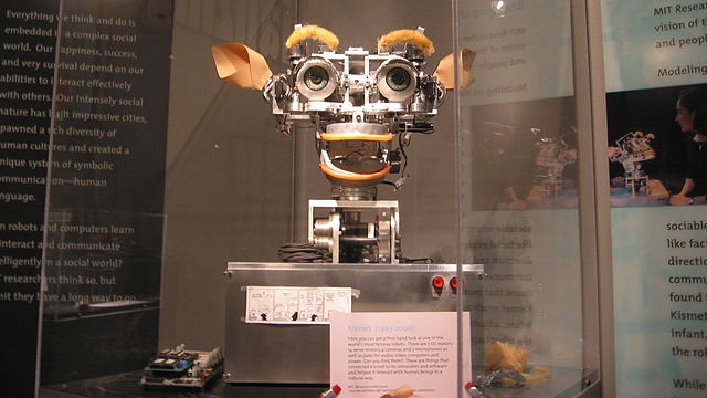 Kismet robot at MIT Museum (cropped), by Polimerek - Wikimedia Creative Commons ( license )