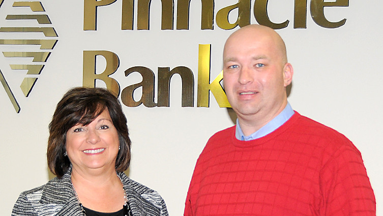ICFF Chair Elizabeth Haarberg accepted the gift from Kelly Hammerlun, Imperial Pinnacle Bank Market President