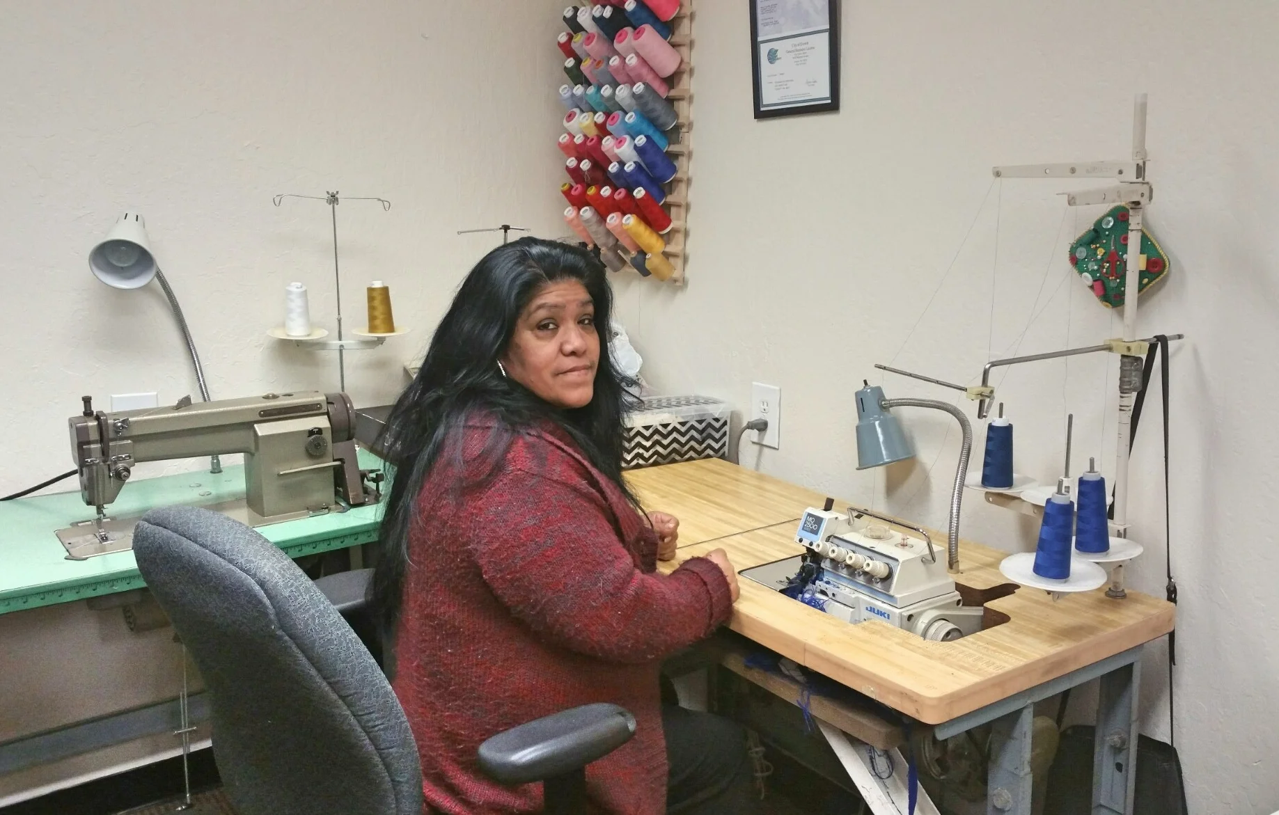 Maria Gutierrez came to Community Enterprise as a referral from the Small Business Development Center in Everett. After being laid off from a wedding gown alteration job at a national bridal shop, Maria decided to pursue her dream of starting her own sewing and alteration business. With years of experience running her own business in Mexico before migrating to the United States, she knew she could do it, but she lacked the necessary financial resources and equipment. A victim of domestic violence and a single mom, Maria and her daughter are currently receiving housing assistance and food stamps to augment their daily needs. After completing our First Step course, we connected Maria to the Latina Education Training Institute to help improve her English and helped her secure a loan of $1,500 to buy a commercial grade sewing machine and launch Yolanda’s Alterations in a subleased storefront space in a busy part of downtown Everett.