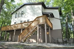 Woodland Retreat is a Boundless country home located in the heart of the Pocono Mountains. Boundless country home located in the heart of the Pocono Mountains. This one-of-a-kind, 3-floor abode is just over an hour from New York City and only minutes from New Jersey. Between its unbeatable location and 3,000 sq. feet of comfort and luxury, this home serves as an amazing getaway for any time of year. Want to kick back on the hammock while your friends barbecue? You can even present your guest passes at the community pool and take a dip on us. Other community amenities include a freshwater lake, basketball courts, tennis courts; volleyball courts. Nearest attractions include Camelback Resort, Shawnee Mountain, Jack Frost, Big Boulder, Mount Airy Casino, Delaware Water Gap and The Crossings Outlet. So what are you waiting for? Visit www.travelandleisure.com and set out to enjoy the best fall experiences.