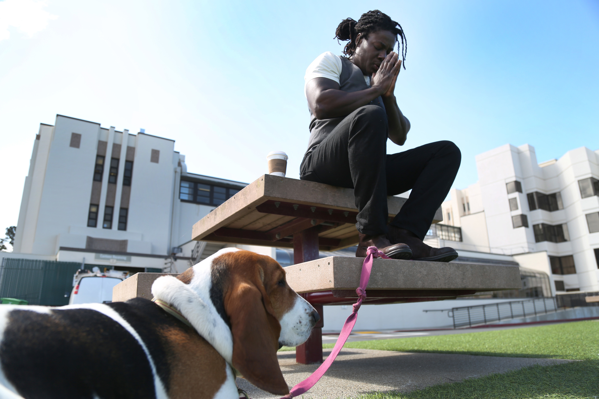  Before entering Skyler Cooper's doctor and therapy appointments they chant outside of the San Francisco VA Medical Center with Freda by her side and a beautiful view of the Golden Gate Bridge&nbsp;Thursday May 7, 2015. 