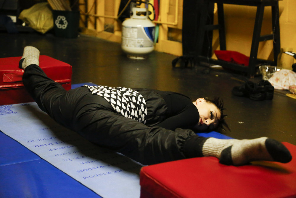  Katie Scarlett stretches back stage before her performance a part of Into the Mouth of the Wolf teaser show by Circus Automatic at 915 Cayuga Ave. in San Francisco, Calif. Saturday August 20, 2016. 