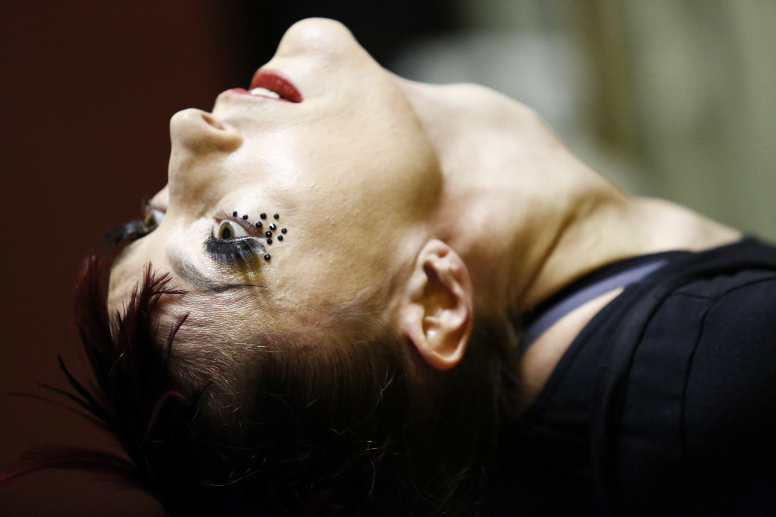  Katie Scarlett stretches back stage before her performance a part of Into the Mouth of the Wolf teaser show by Circus Automatic at 915 Cayuga Ave. in San Francisco, Calif. Saturday August 20, 2016. 