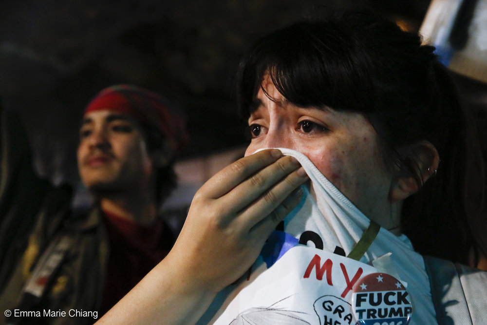  Jaqueline Castillo covers her nose after the Oakland Police Department fired tear gase during an anti-Trump protest through the streets of downtown OaklandWednesday Nov. 9 2016. Photo by Emma Chiang 