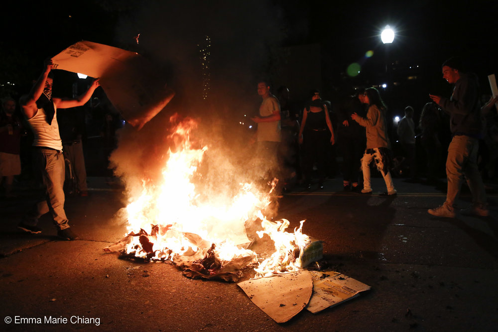  Anti-Trump protesters lite fires on Washington Street in Oakland Calif. Wednesday Nov. 9 2016. Photo by Emma Chiang 