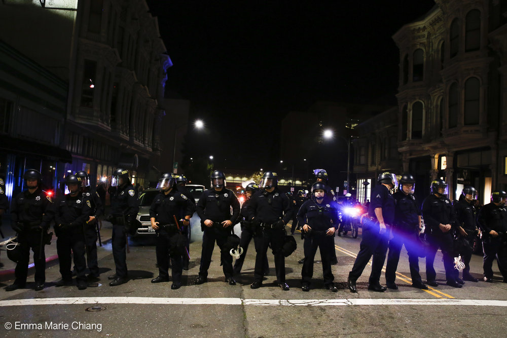  Oakland police officers block Washington Street during an anti-Trump protesters Wednesday Nov. 9 2016. Photo by Emma Chiang 