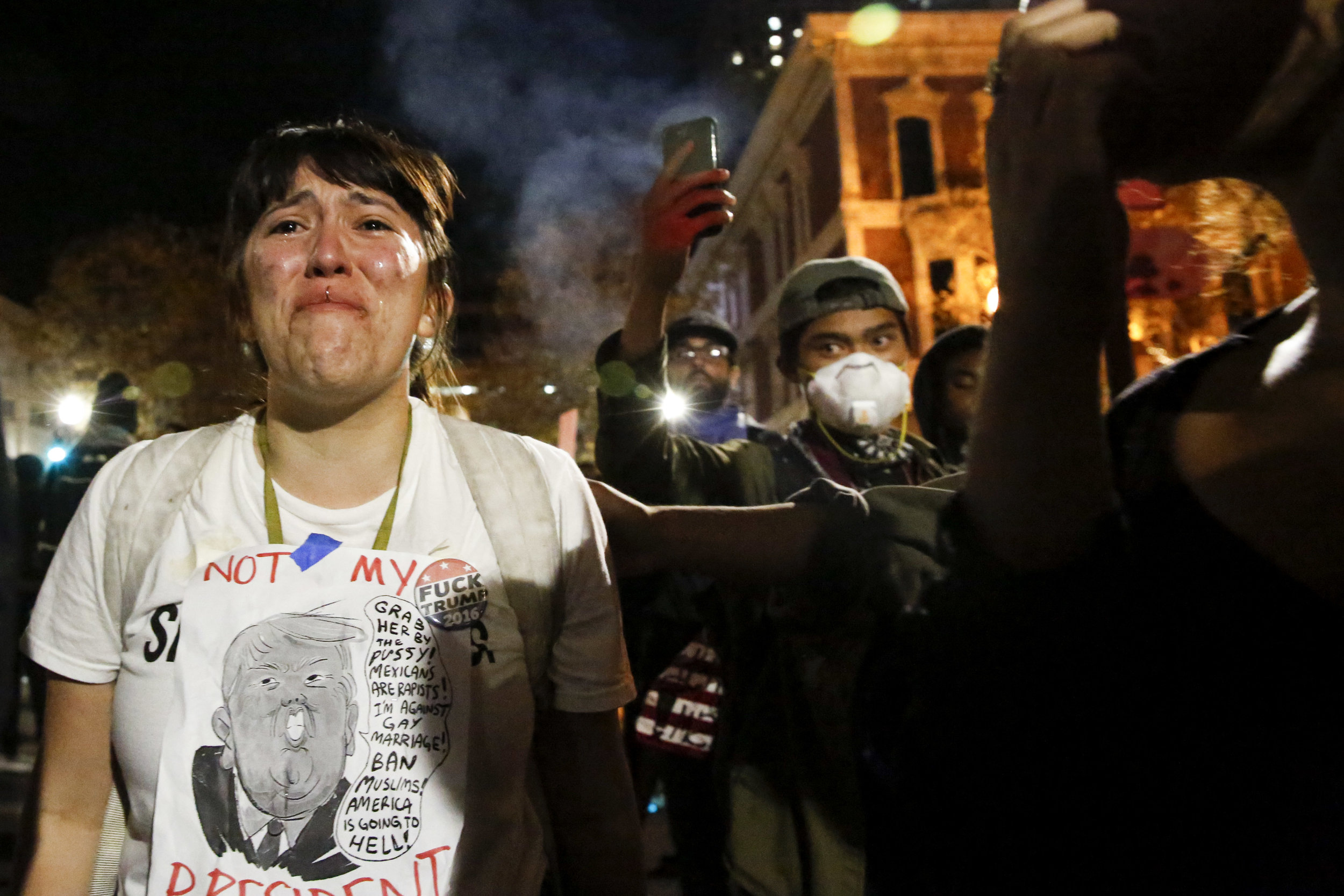  Jaqueline Castillo stands in anger at Oakland Police during an anti-Trump protest through the streets of downtown Oakland Wednesday Nov. 9 2016. Photo by Emma Chiang 