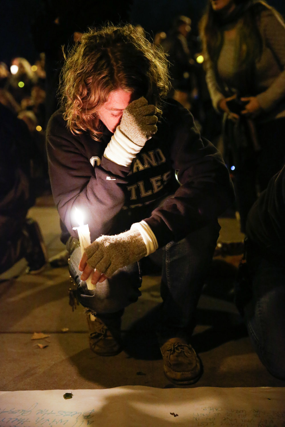  A women holds back tears at a vigil for the victims of the fatal warehouse fire during a vigil at Lake Merritt Pergola in Oakland, California, U.S. December 5, 2016.&nbsp; 