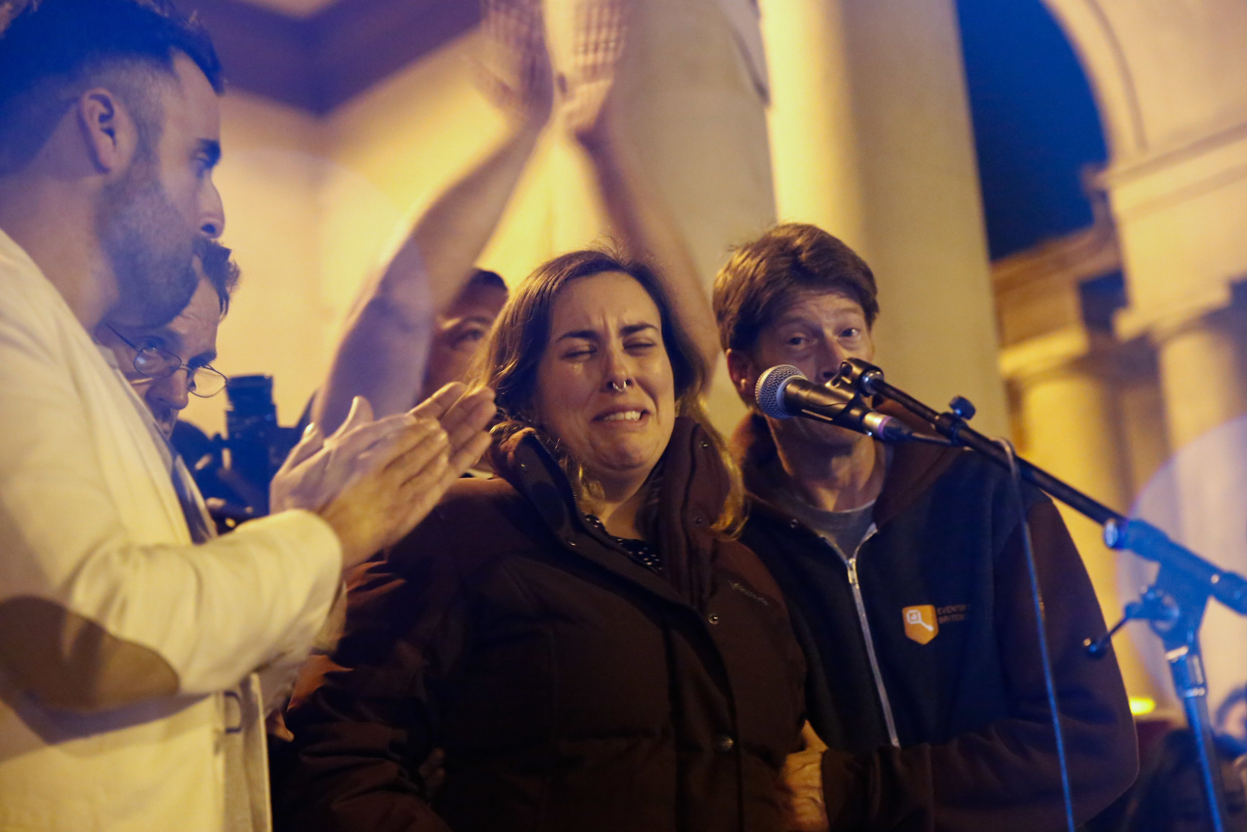  A women cry after sharing about a friend who died in the fatal warehouse fire during a vigil at Lake Merritt Pergola in Oakland, California, U.S. December 5, 2016. 