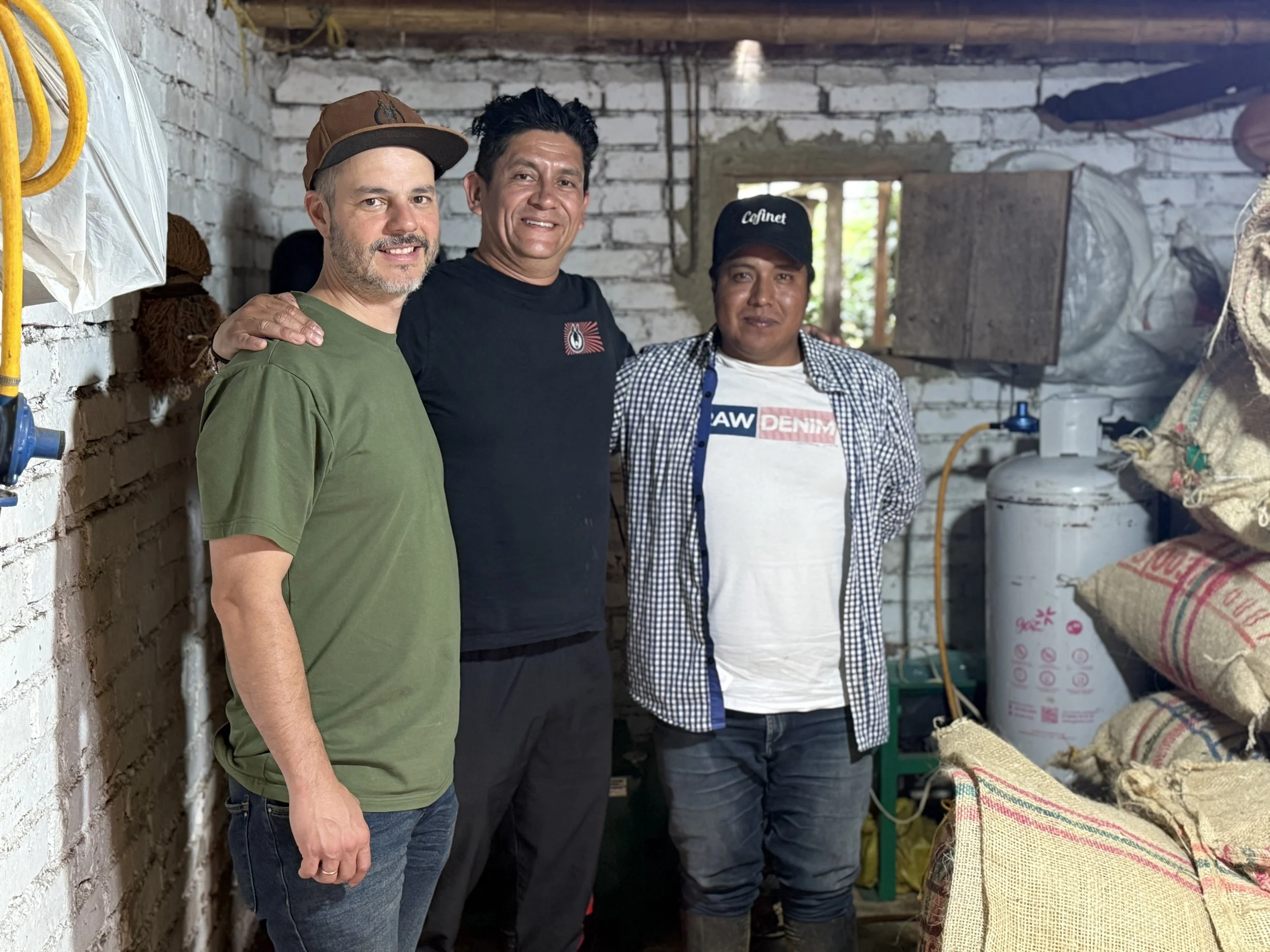 Cesar and Nico with a coffee farmer