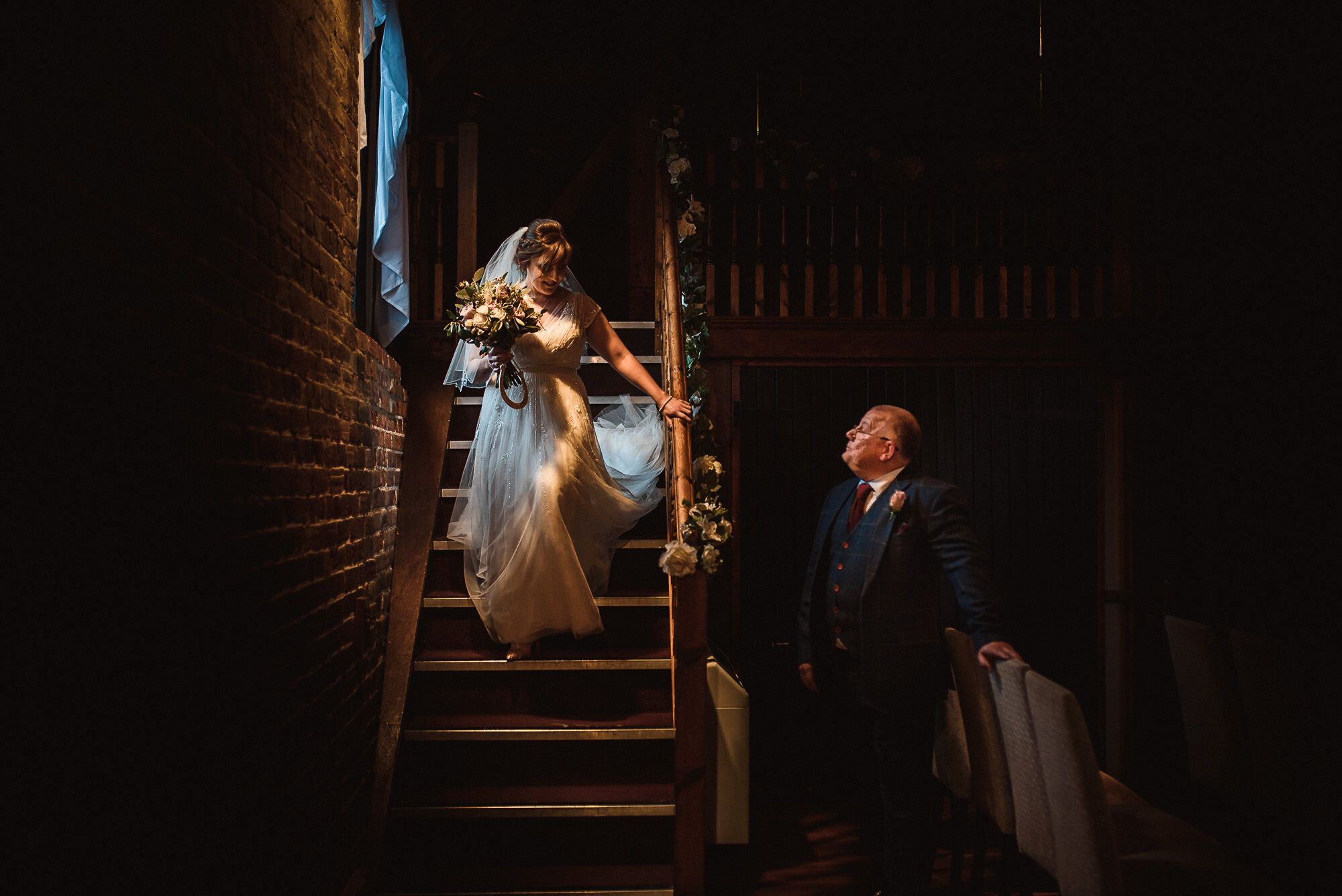 bride walks down stairs