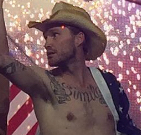 "Simila" tattooed in large script across his chest