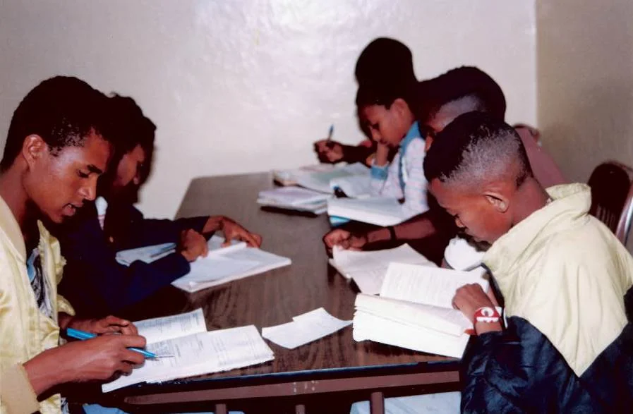 Many students lack adequate study space in often crowded homes. The library offers a place for them to do their work in a quiet and ordered environment.