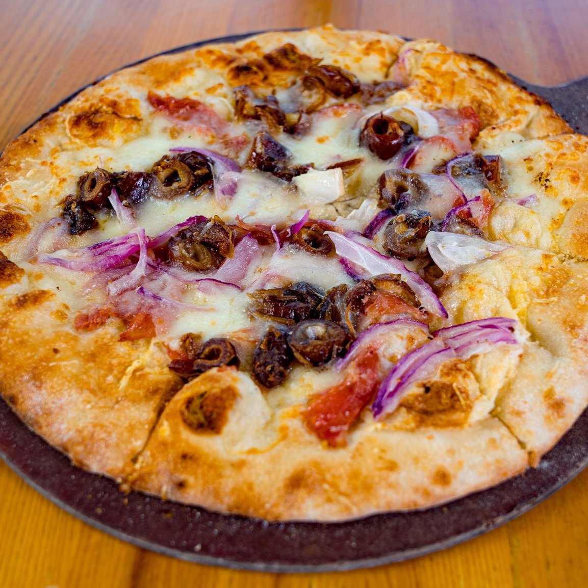Hey food lovers, why just wine and dine when you can truffle and date at the same time? Try our Truffle &amp; Date Pizza, where every slice is a mingle-fest of prosciutto, sweet dates, and a drizzle of white truffle oil that'll make your tastebuds sw