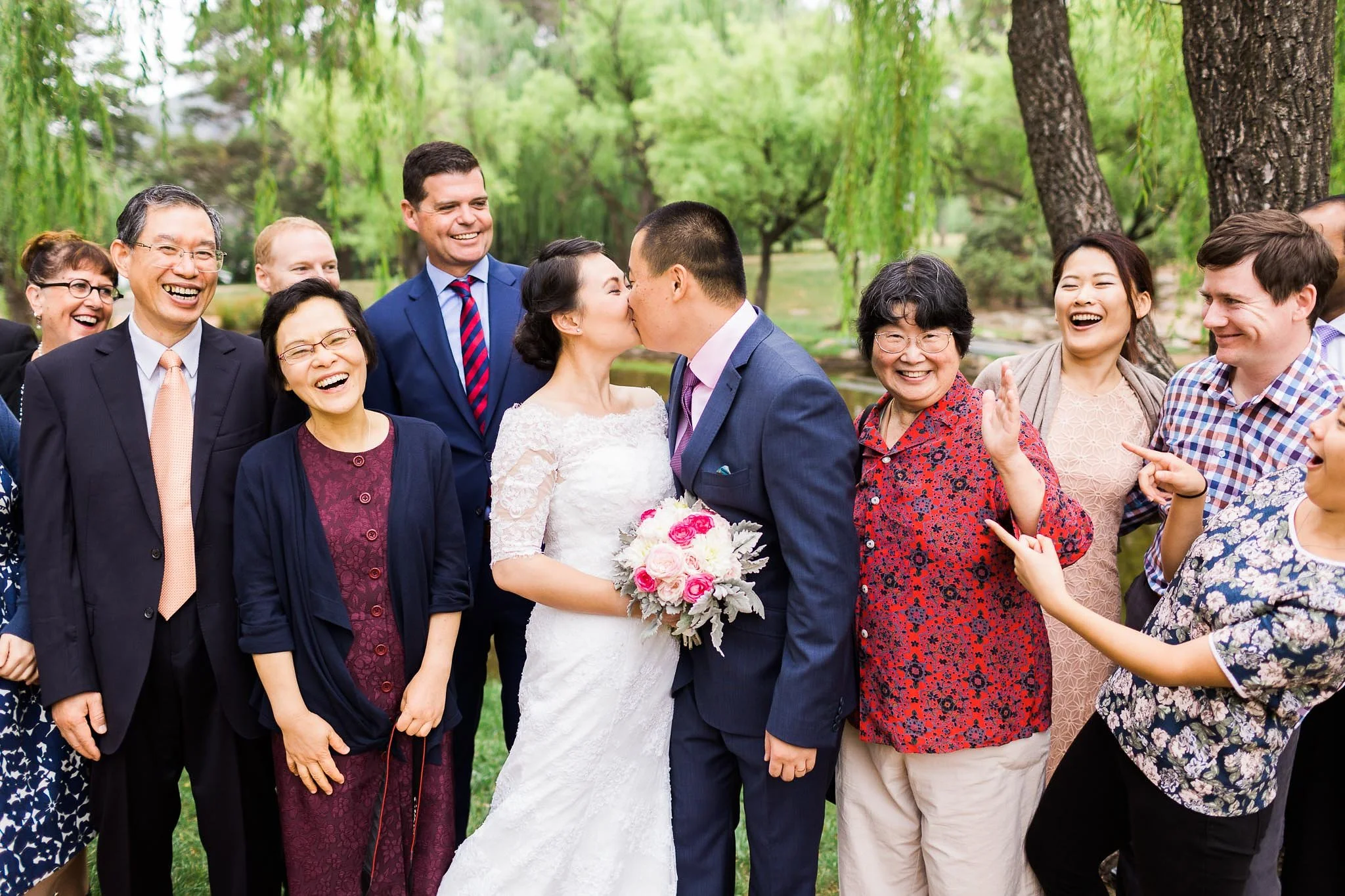 A fun kissing shot at a small wedding in Canberra