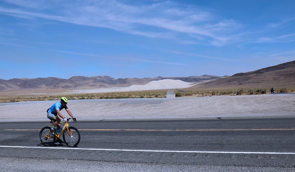In his first mile of his first leg of the race, Kevin rides by Sand Mountain, an iconic landmark. The mountain changes shape every day due to the circular wind patterns in the valley (which are also the reason the mountain of sand is there in the first place.) It’s most commonly used by four-wheelers and other ATV fans who camp at the base of the mountain and spend their days climbing up its varied terrain. Legend has it that a Wells Fargo wagon loaded with gold was passing through the valley back in the late 19th century, and parked near Sand Mountain at night. When whoever was driving the wagon woke the next morning, it was gone; the wind and sand had engulfed the wagon and all that was inside. No one’s ever found any trace of it, and the legend continues to this day.