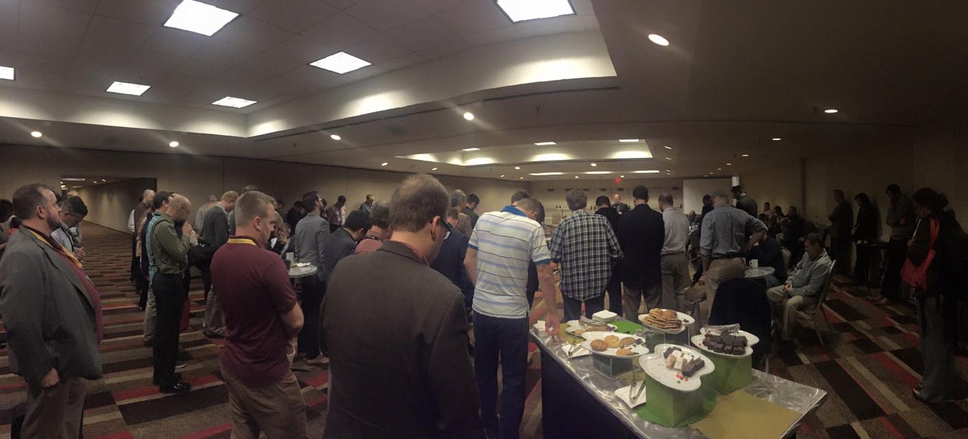A time of prayer during the annual EPS reception. Though there are a lot of different views represented in the society, this is a great picture of what unites us. (Thanks to Mary Jo Sharp for the photo.)