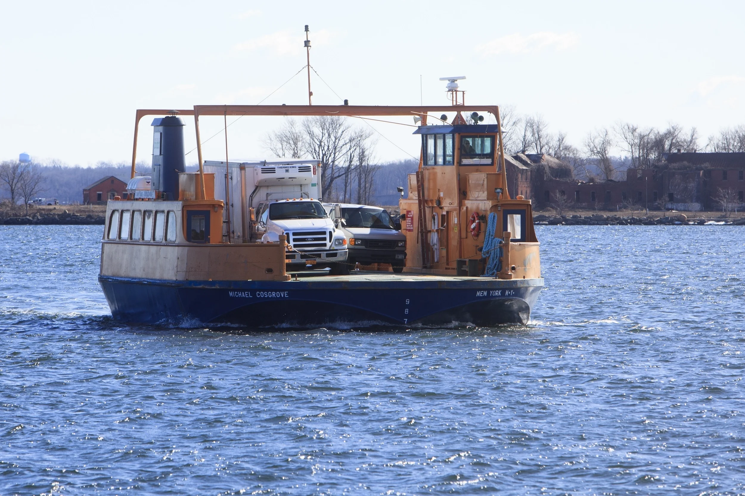 A medical examiner's truck returning from Hart Island after having brought bodies for burial.
