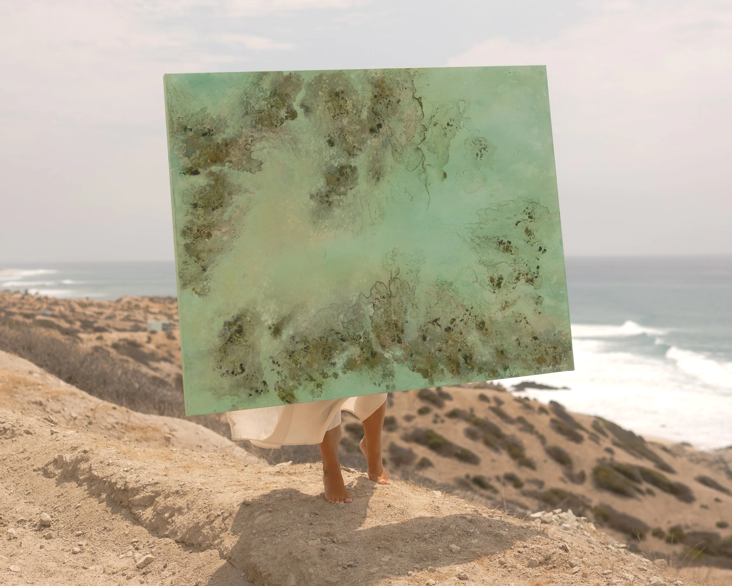 holding the oil painting of earthy tones similar to a reef at the east cape