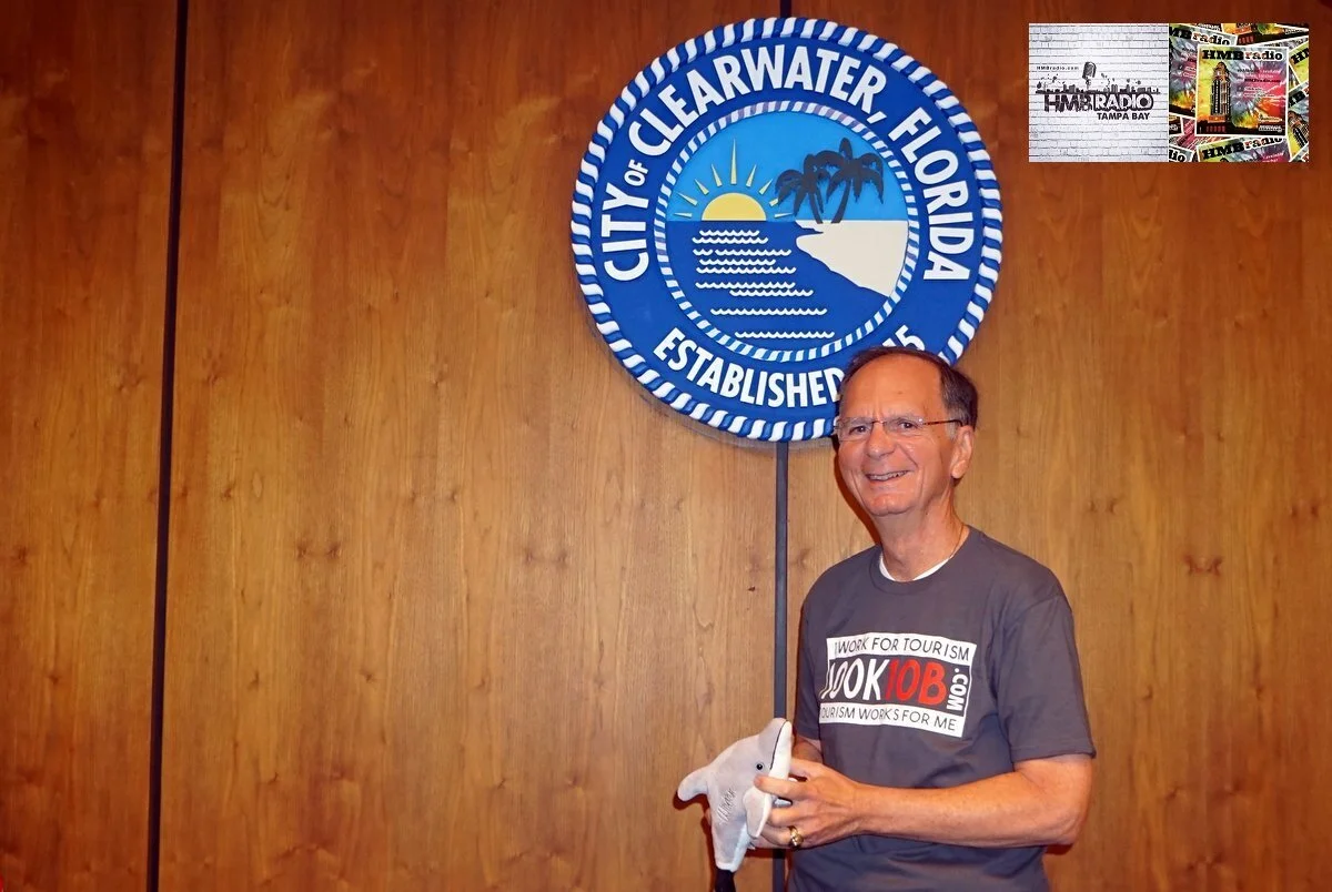 Photo from @myclearwater Twitter account- George Cretekos holding an assault dolphin.