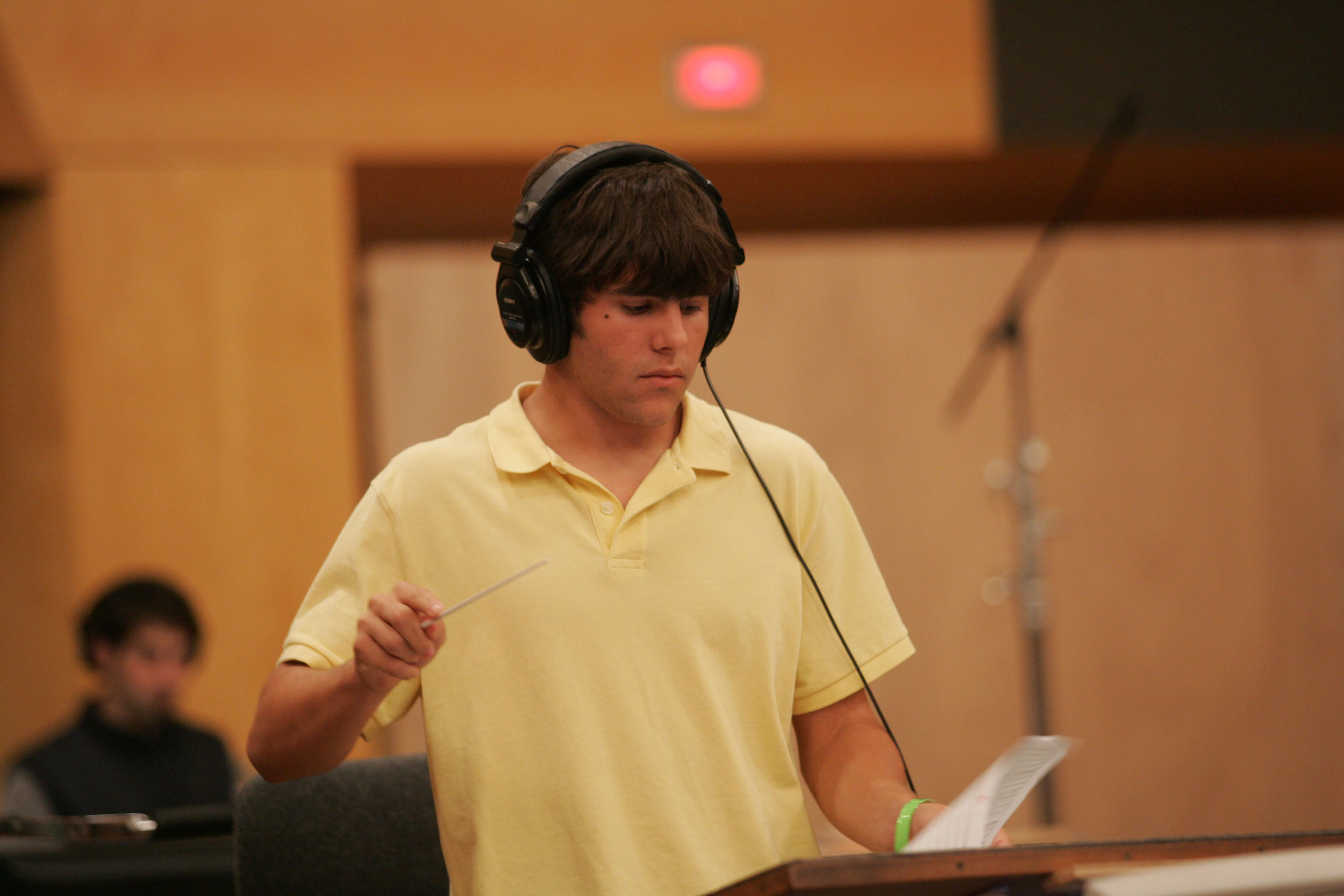 Camper conducting his original score with a 30-piece orchestra on the Newman Scoring Stage at 20th Century Fox