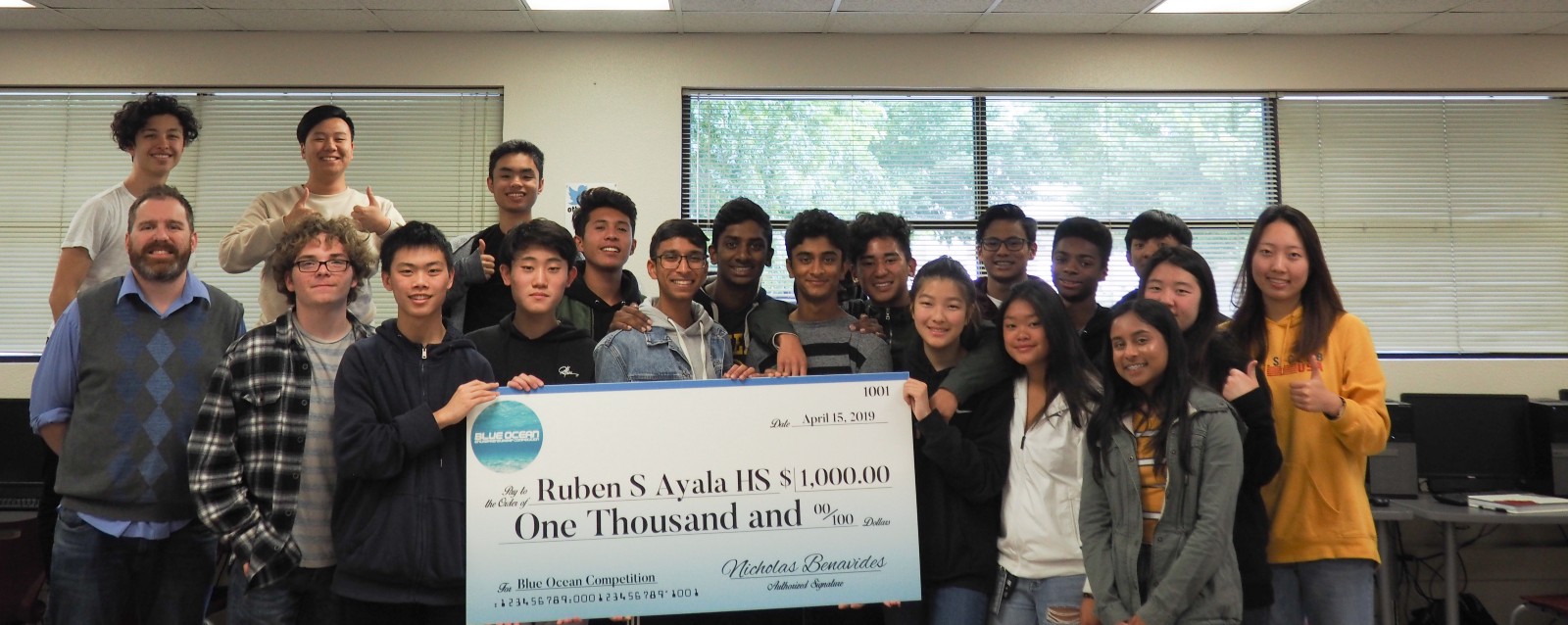 Students at Ruben S. Ayala High School in Chino Hills, CA receiving their $1k prize check with Computer Science Teacher Derek Arnell.