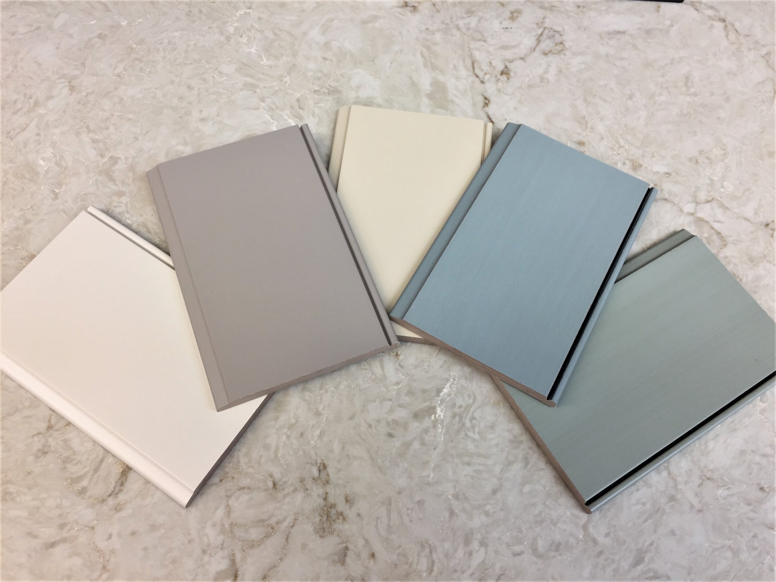 From Left to Right: "White Sand", "Khaki", "Fawn", "Mystic Blue", "Mystic Green"