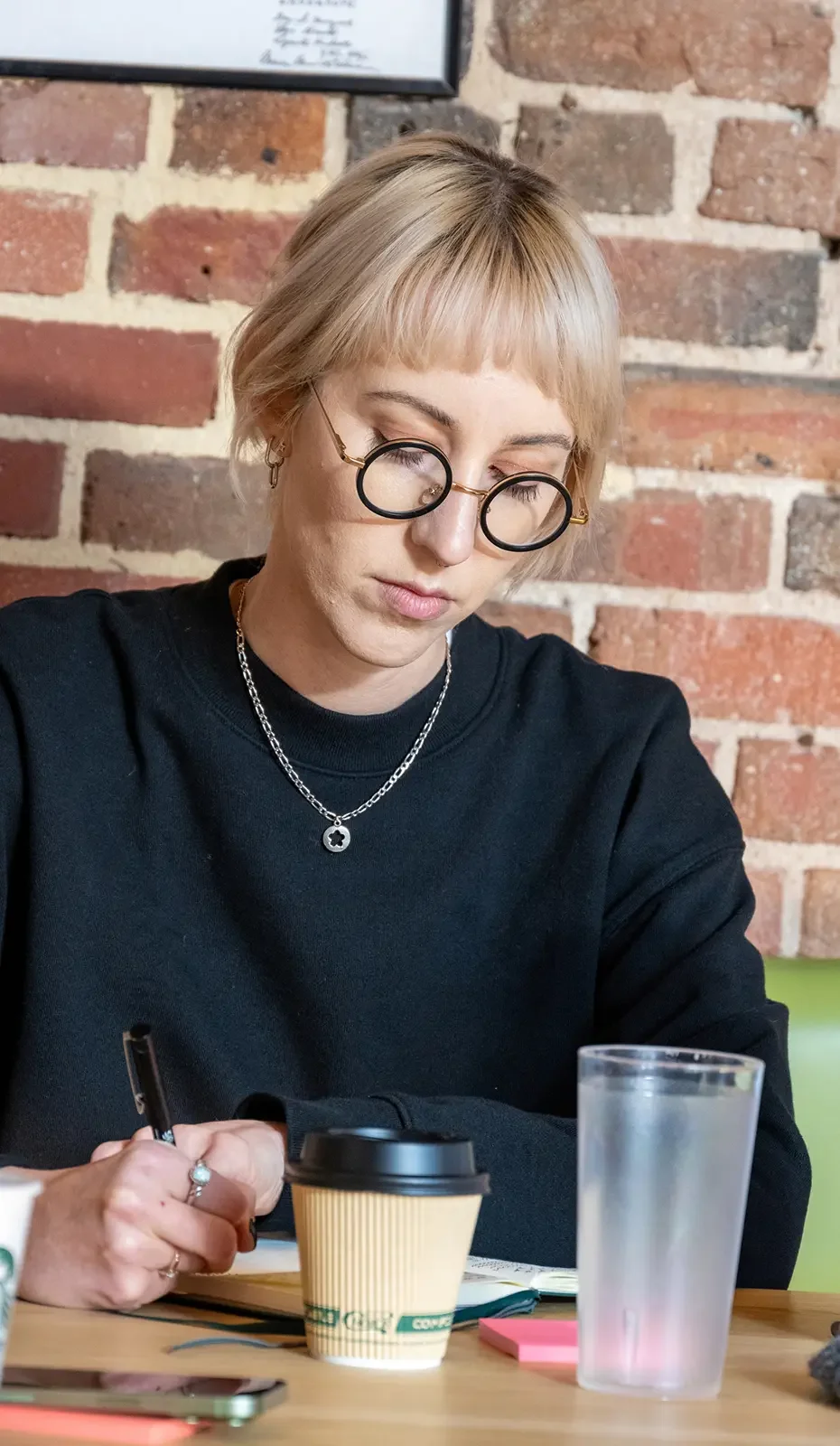 A The Ready member taking notes during a working session.