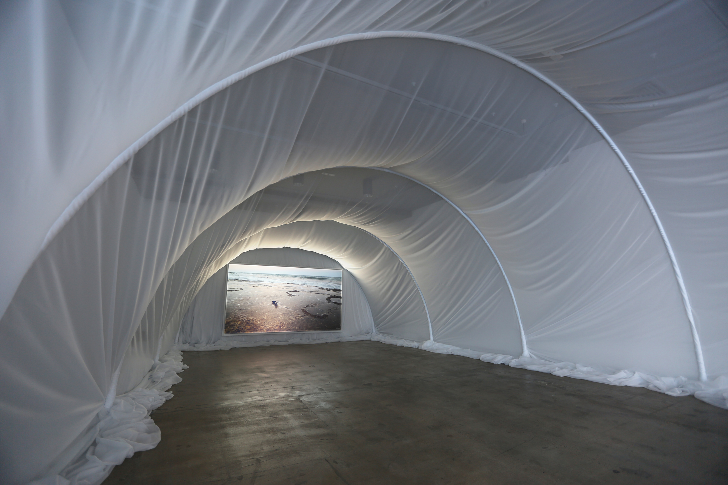 The Waves (Installation View at the IMA), 2013, Steel, Voile and Digital Video, 600cm (w) x 800cm (d) x 300cm (h), 15:03.