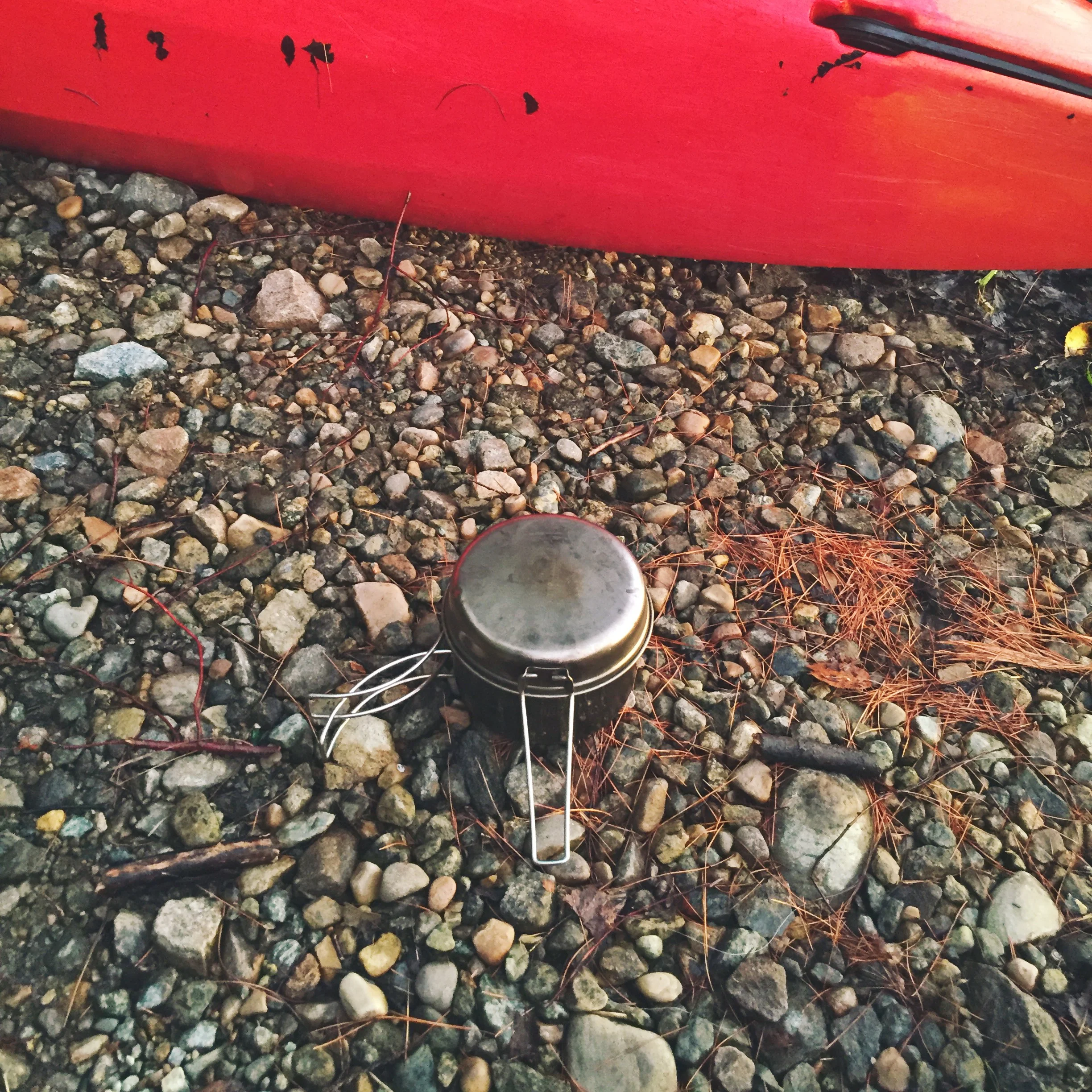 Boiling water for dinner by the shore