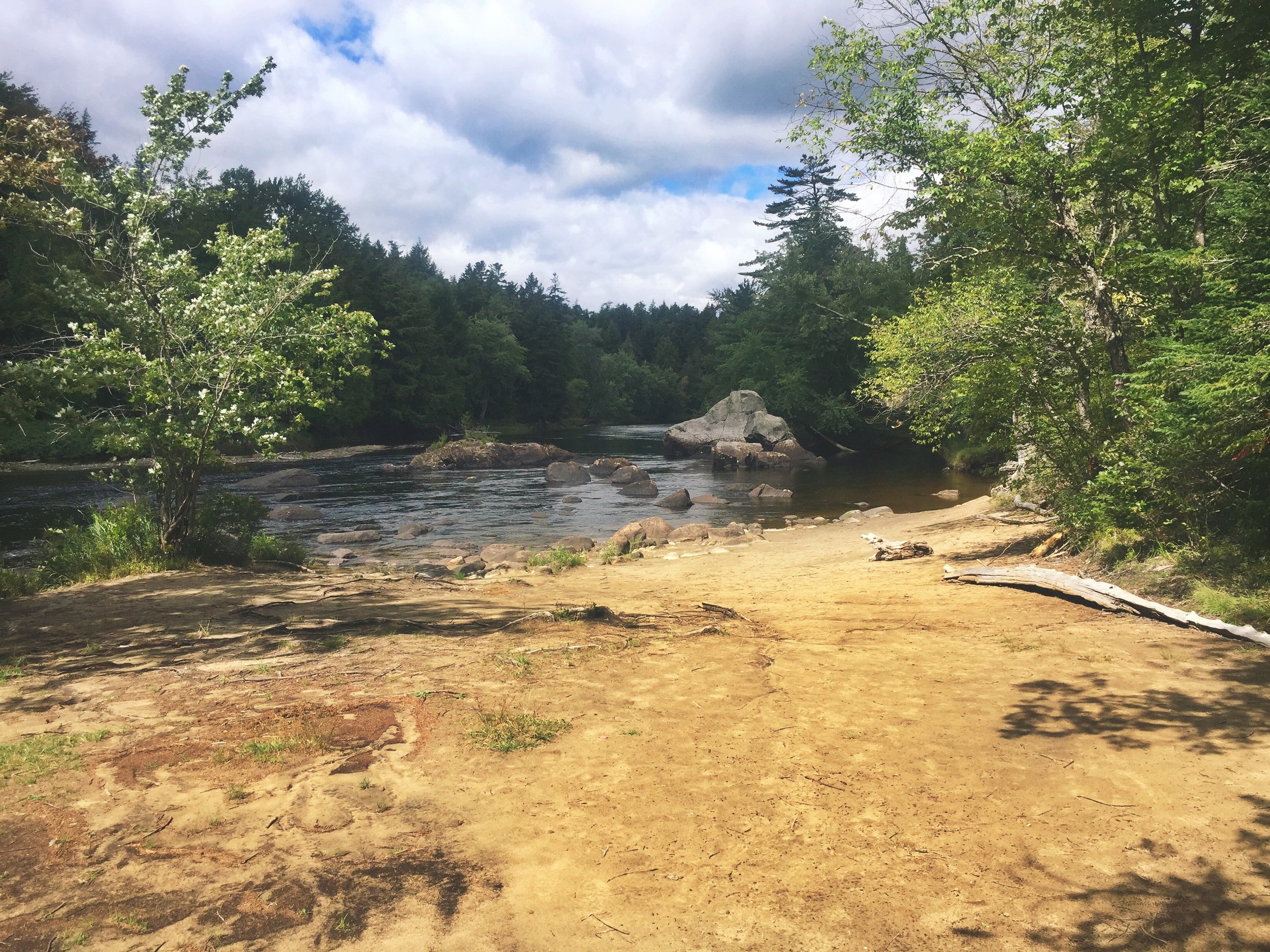 After straining to carry everything through the portage, I was ecstatic to connect with the river once more!